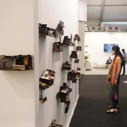 A viewer looking at Abhishek Dodiya's work